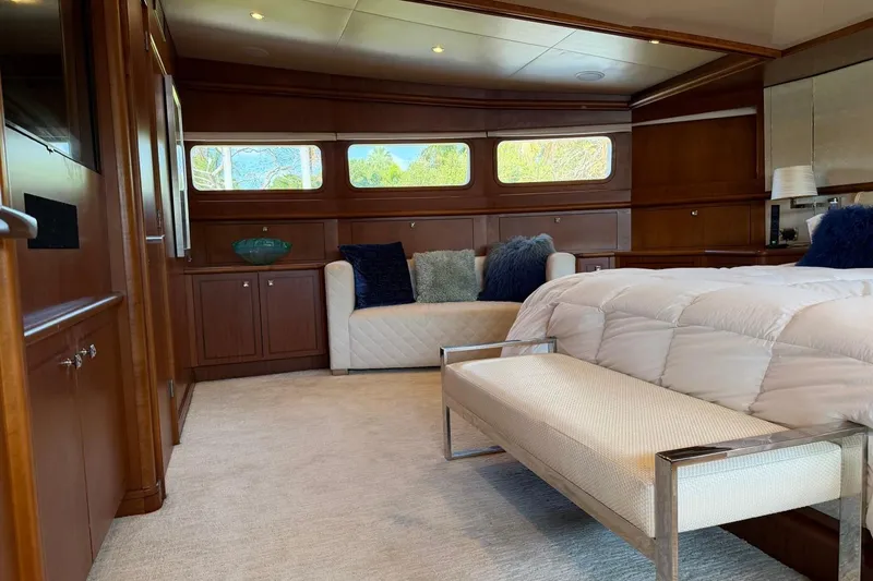 Slide: The Image of Luxurious Heesen 144 yacht bedroom interior, featuring elegant wood paneling and plush furnishings, 1990 model. - 51