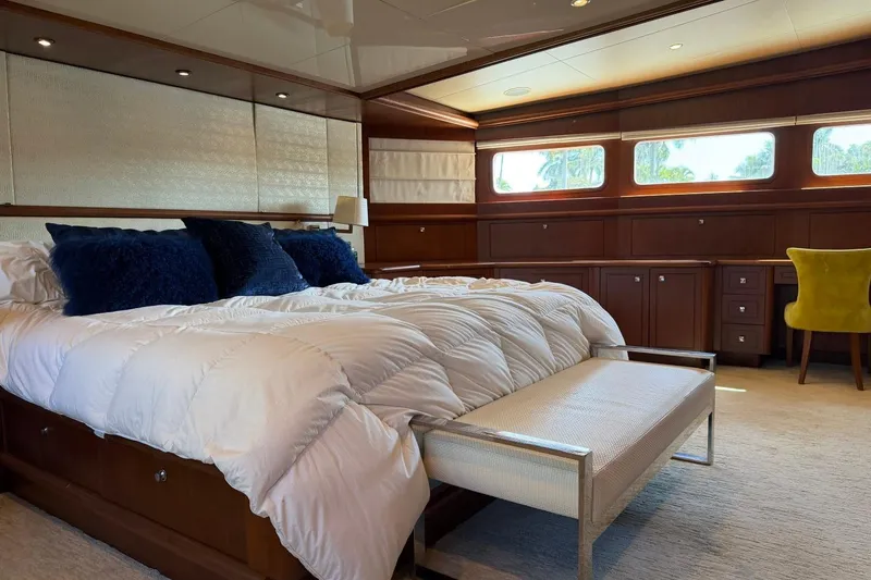 Slide: The Image of Luxurious bedroom interior on 1990 Heesen 144 yacht with elegant furnishings and natural light. - 54