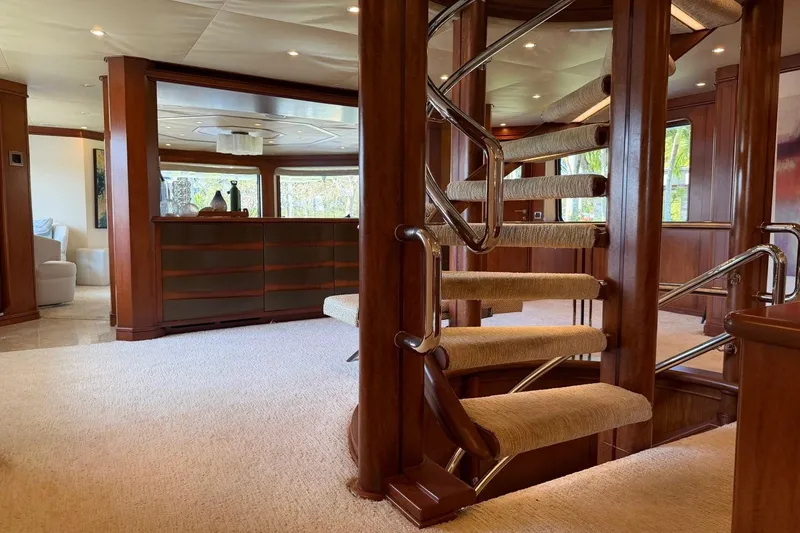Slide: The Image of Luxurious interior of 1990 Heesen 144 yacht with elegant spiral staircase and wooden finishes. - 56