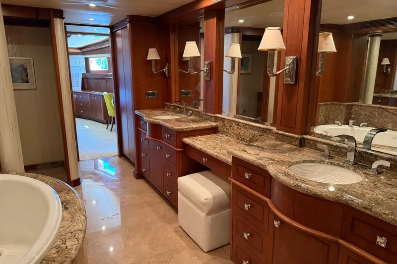 Slide: The Image of Luxurious bathroom interior on 1990 Heesen 144 yacht with marble countertops and elegant wood cabinetry. - 58