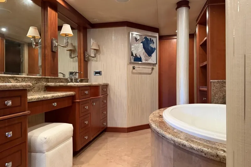 Slide: The Image of Luxurious bathroom interior on 1990 Heesen 144 yacht, featuring elegant wood cabinetry and marble accents. - 60