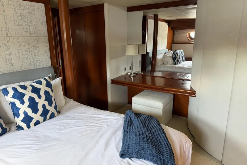 Slide: The Image of Luxurious Heesen 144 yacht bedroom with elegant decor and plush bedding, 1990 model. - 66