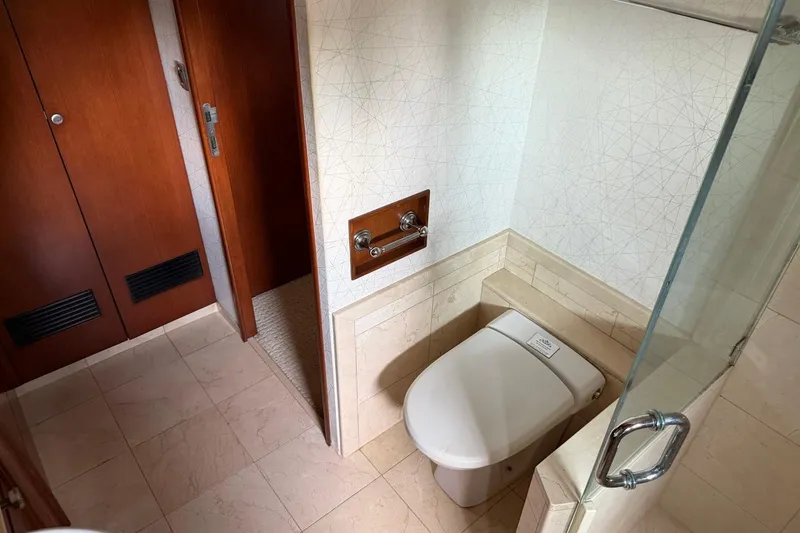 Slide: The Image of Luxurious bathroom on 1990 Heesen 144 yacht, featuring modern fixtures and elegant wood accents. - 68