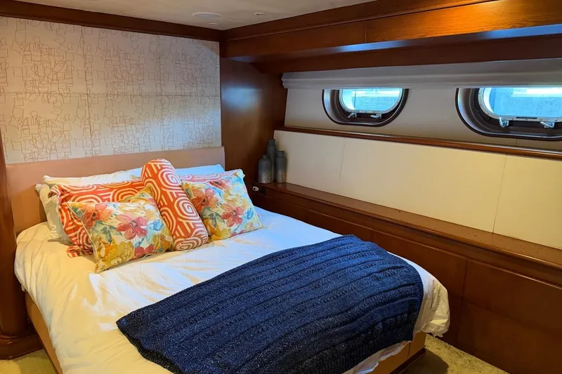 Slide: The Image of Luxurious bedroom interior on 1990 Heesen 144 yacht with colorful pillows and porthole windows. - 75