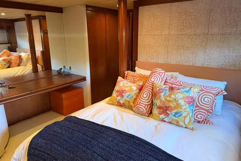 Slide: The Image of Luxurious bedroom interior on 1990 Heesen 144 yacht with vibrant pillows and elegant decor. - 76