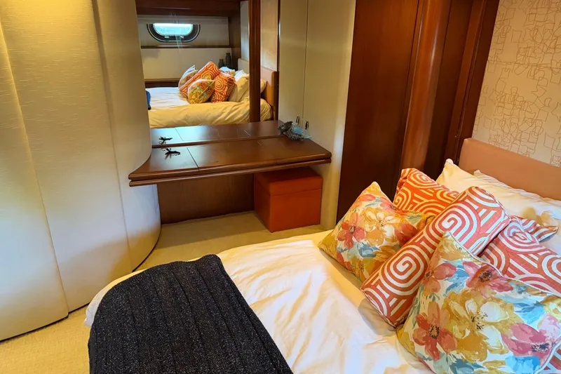 Slide: The Image of Luxurious Heesen 144 yacht bedroom with vibrant pillows and elegant wood accents, 1990 model. - 77