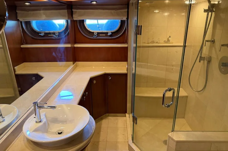 Slide: The Image of Luxurious bathroom on 1990 Heesen 144 yacht with glass shower and elegant fixtures. - 79