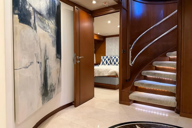 Slide: The Image of Luxurious interior of 1990 Heesen 144 yacht with elegant staircase and modern artwork. - 86