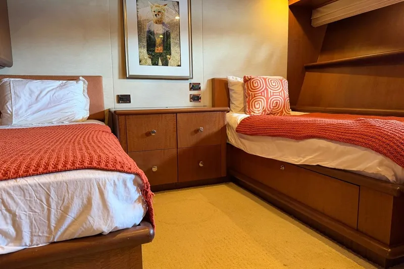 Slide: The Image of Twin cabin with orange decor on a 1990 Heesen 144 yacht. - 89
