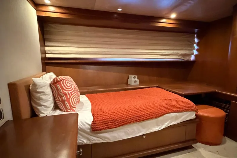 Slide: The Image of Luxurious cabin interior of 1990 Heesen 144 yacht with cozy bed and warm decor. - 91