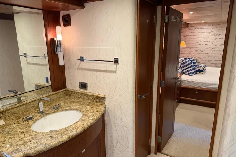Slide: The Image of Luxurious Heesen 144 yacht interior, featuring elegant bathroom and cozy bedroom, 1990 model. - 99