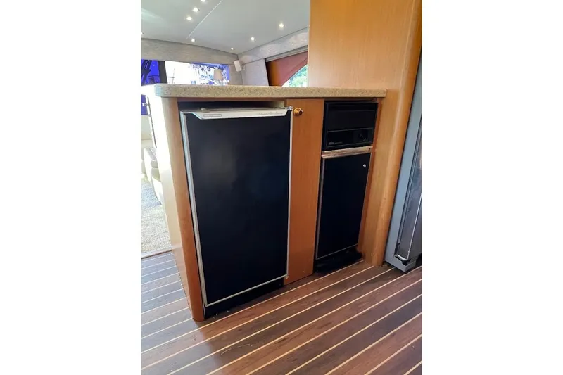 Slide: The Image of Interior of 2002 Ocean Yachts 56 Super Sport with compact kitchen appliances. - 10