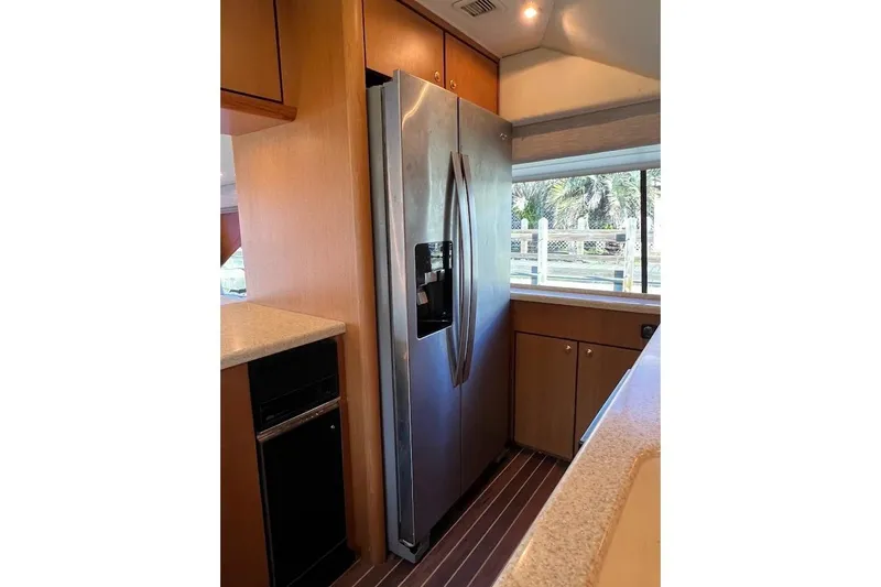 Slide: The Image of Interior of 2002 Ocean Yachts 56 Super Sport with modern kitchen appliances. - 12