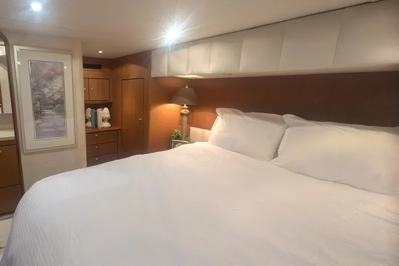 Slide: The Image of Luxurious bedroom interior of 2002 Ocean Yachts 56 Super Sport with elegant decor. - 13