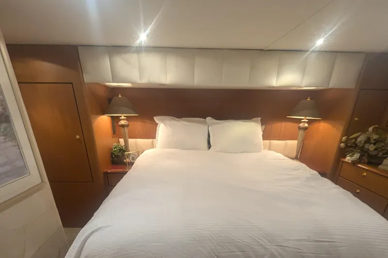 Slide: The Image of Luxurious bedroom interior of 2002 Ocean Yachts 56 Super Sport with elegant lighting. - 15