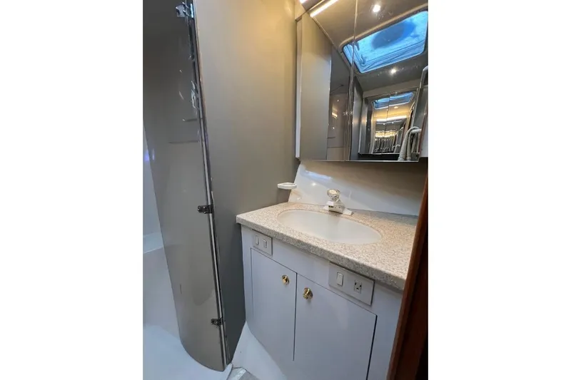 Slide: The Image of Luxurious bathroom in 2002 Ocean Yachts 56 Super Sport with modern fixtures and elegant design. - 23