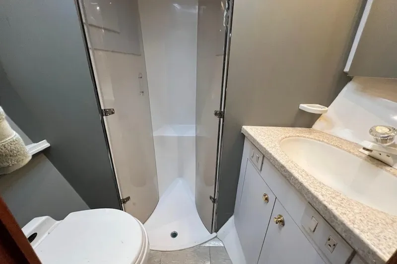 Slide: The Image of Bathroom interior of 2002 Ocean Yachts 56 Super Sport with shower and sink. - 24