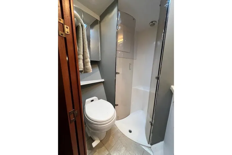 Slide: The Image of Bathroom interior of 2002 Ocean Yachts 56 Super Sport with shower and toilet. - 25