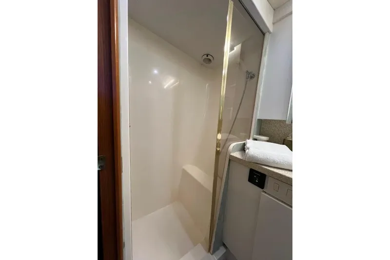 Slide: The Image of Shower area in 2002 Ocean Yachts 56 Super Sport, featuring sleek design and modern amenities. - 29