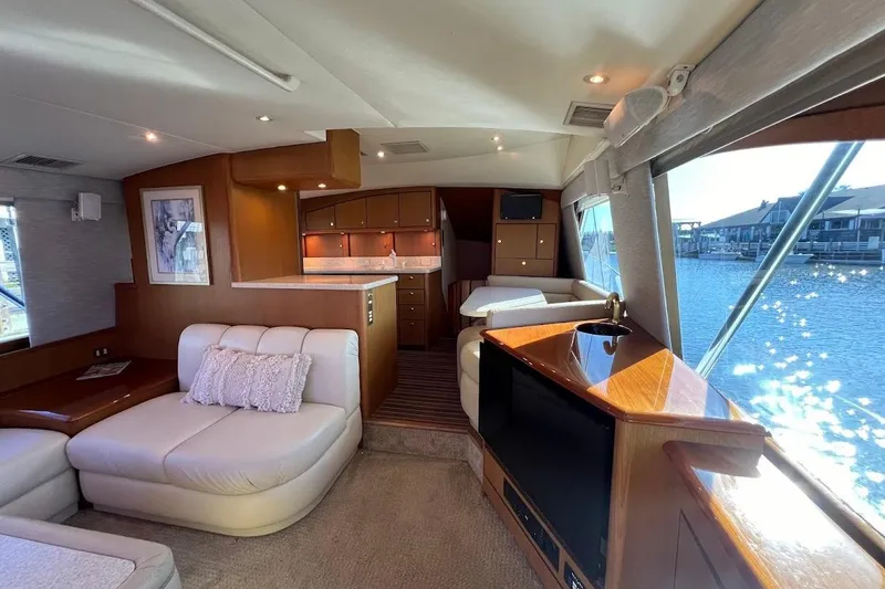 Slide: The Image of Luxurious interior of a 2002 Ocean Yachts 56 Super Sport with elegant furnishings and waterfront view. - 3