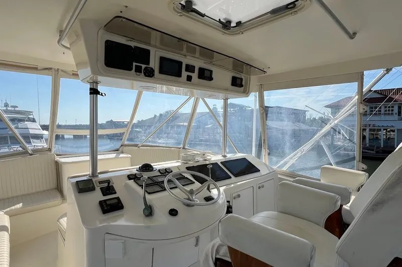 Slide: The Image of Helm of 2002 Ocean Yachts 56 Super Sport with modern navigation equipment and panoramic views. - 32