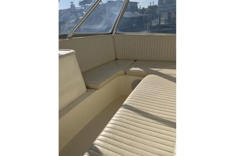 Slide: The Image of Interior seating of 2002 Ocean Yachts 56 Super Sport, featuring cream-colored upholstery. - 35
