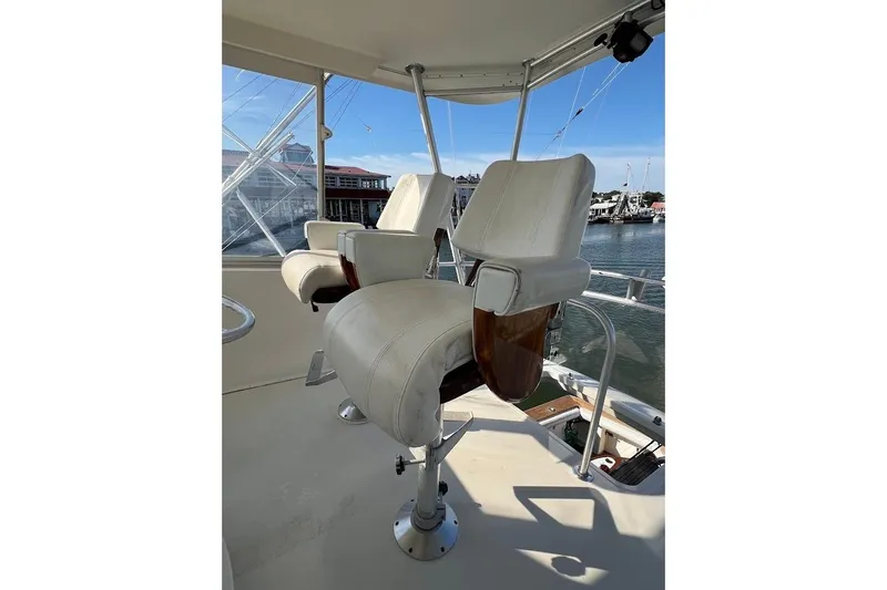 Slide: The Image of Captain's chairs on 2002 Ocean Yachts 56 Super Sport, overlooking marina. - 36