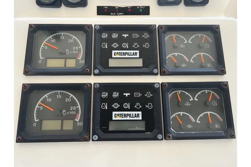 Slide: The Image of Instrument panel of a 2002 Ocean Yachts 56 Super Sport with Caterpillar gauges. - 38