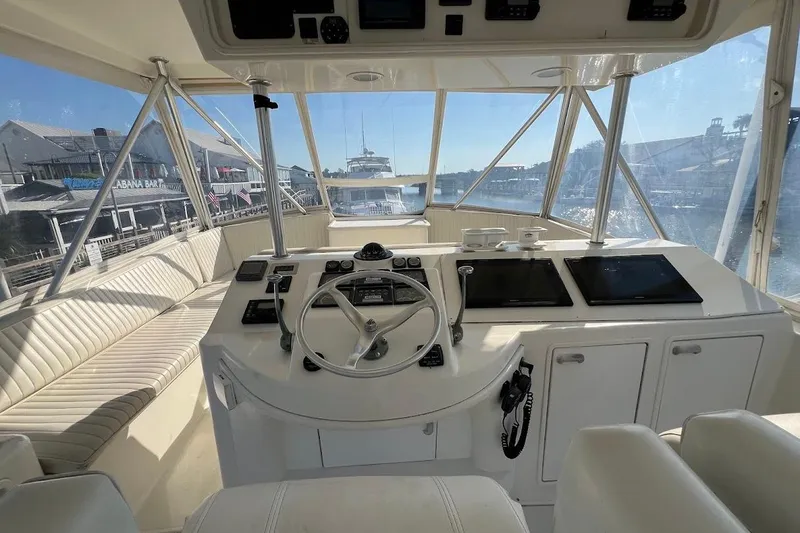 Slide: The Image of Interior view of 2002 Ocean Yachts 56 Super Sport helm with panoramic windows. - 39