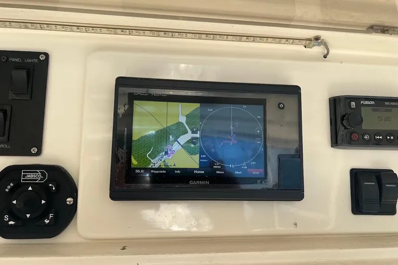 Slide: The Image of Garmin navigation system on 2002 Ocean Yachts 56 Super Sport dashboard. - 42