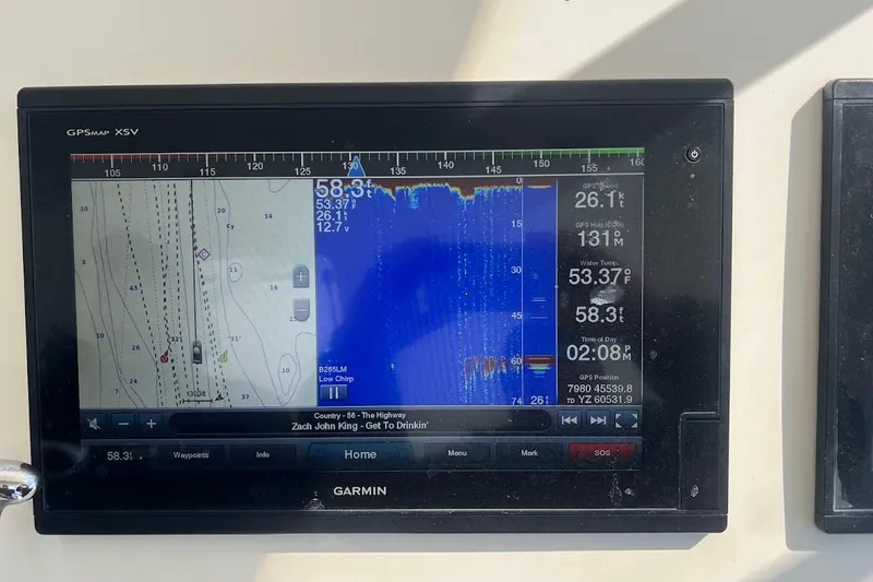 Slide: The Image of Garmin GPS display on 2002 Ocean Yachts 56 Super Sport, showing navigation and sonar data. - 46