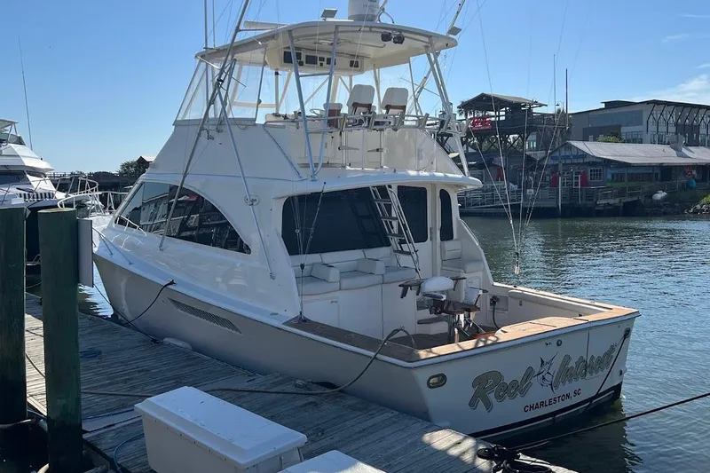 Slide: The Image of Ocean Yachts 56 Super Sport 2002 docked, rear view, sunny day, marina setting. - 51