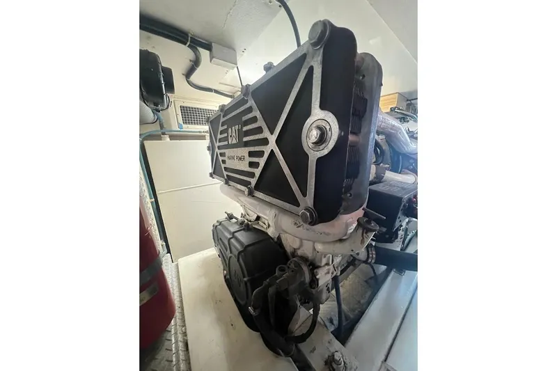 Slide: The Image of Engine room of 2002 Ocean Yachts 56 Super Sport, featuring CAT marine power engine. - 54