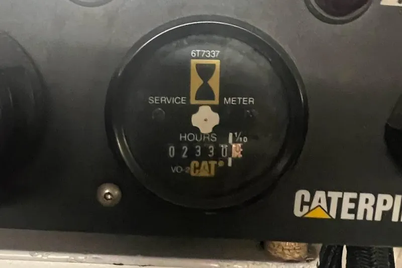 Slide: The Image of Caterpillar service meter showing 2330 hours on Ocean Yachts 56 Super Sport, 2002 model. - 58