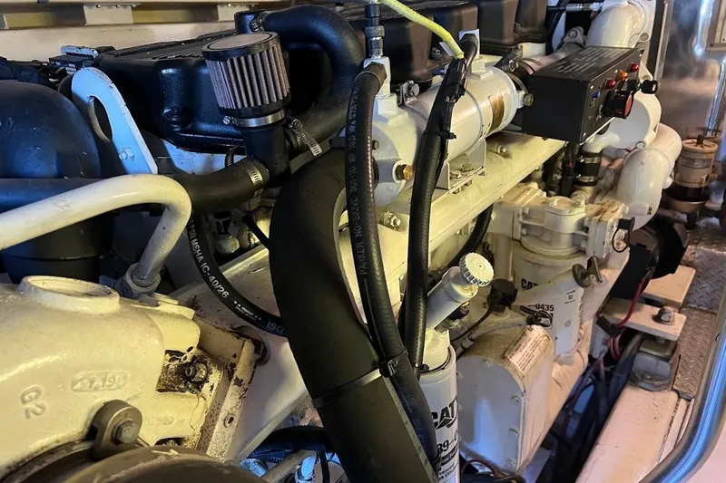 Slide: The Image of Engine compartment of a 2002 Ocean Yachts 56 Super Sport, showcasing detailed components. - 60