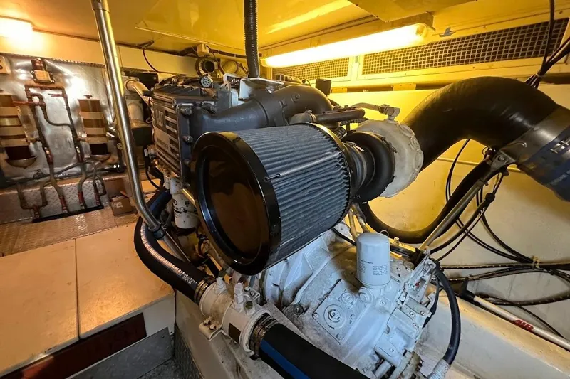 Slide: The Image of Engine room of 2002 Ocean Yachts 56 Super Sport, showcasing mechanical components. - 61