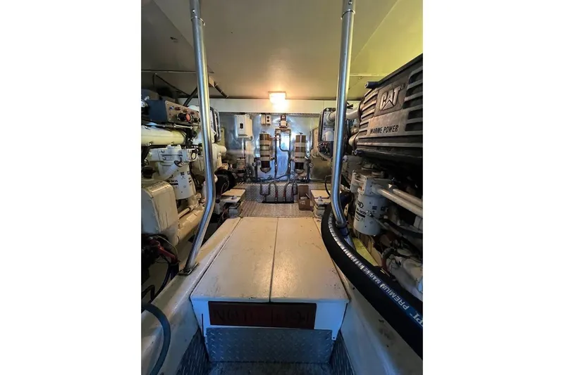 Slide: The Image of Engine room of 2002 Ocean Yachts 56 Super Sport, featuring CAT marine power systems. - 63