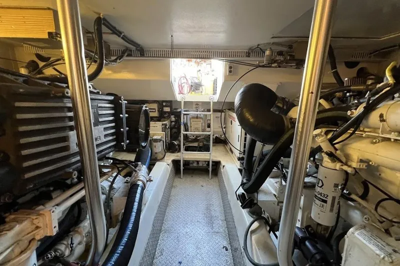 Slide: The Image of Engine room of 2002 Ocean Yachts 56 Super Sport, showcasing mechanical components and equipment. - 65
