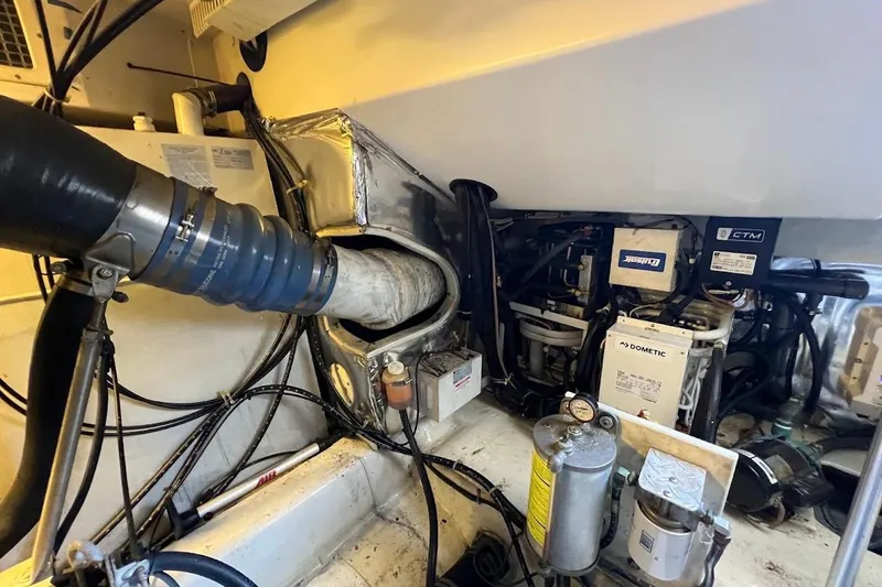 Slide: The Image of Engine room of 2002 Ocean Yachts 56 Super Sport, showcasing mechanical components and systems. - 68