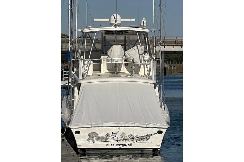 Slide: The Image of 2002 Ocean Yachts 56 Super Sport docked, rear view with covered deck, Charleston, SC. - 78