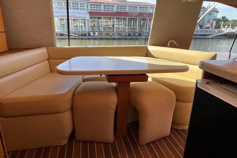 Slide: The Image of Luxurious interior of 2002 Ocean Yachts 56 Super Sport with elegant dining area. - 8