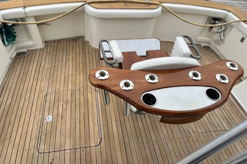Slide: The Image of Teak deck of 2002 Ocean Yachts 56 Super Sport with fishing rod holders. - 83
