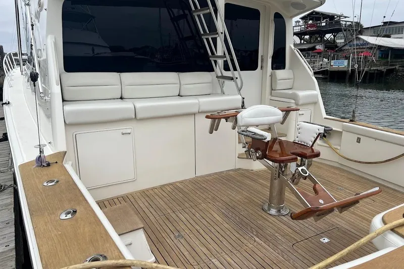 Slide: The Image of 2002 Ocean Yachts 56 Super Sport fishing deck with seating and rod holders. - 84