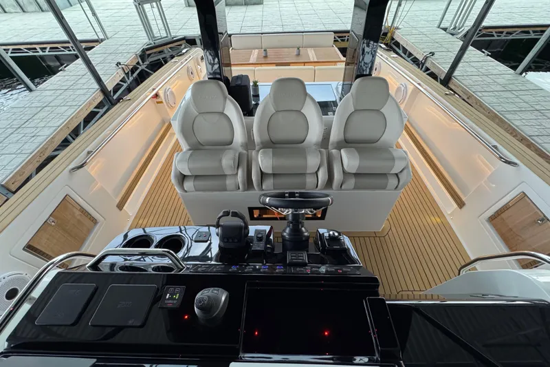 Slide: The Image of Interior view of 2025 Pardo Yachts P38, featuring luxurious seating and modern controls. - 11