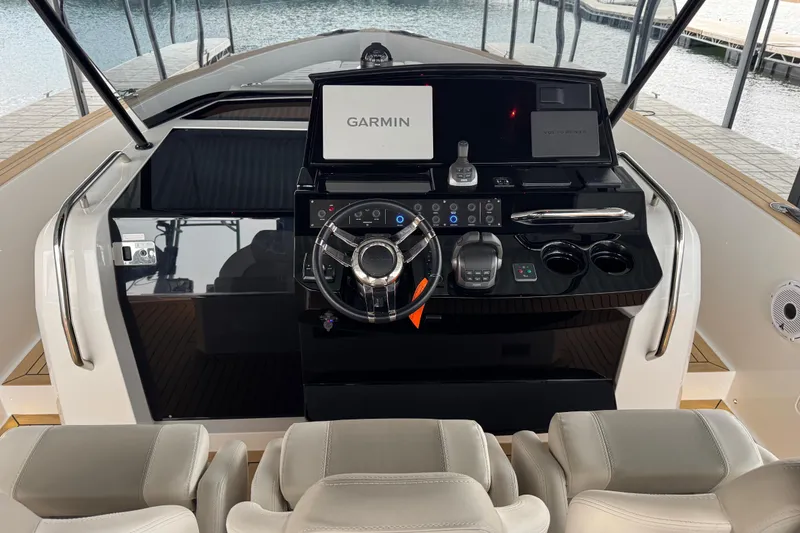 Slide: The Image of Helm of 2025 Pardo Yachts P38 featuring Garmin navigation system and modern controls. - 14