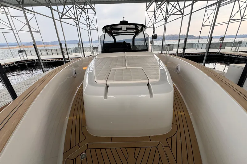 Slide: The Image of 2025 Pardo Yachts P38 docked, showcasing sleek design and spacious deck. - 17