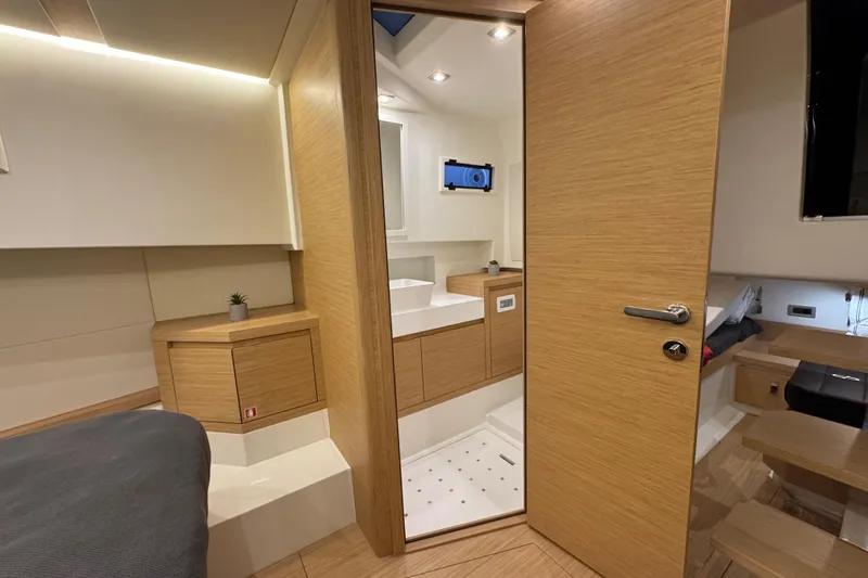 Slide: The Image of Luxurious interior of 2025 Pardo Yachts P38, featuring modern wood finishes and sleek design. - 24