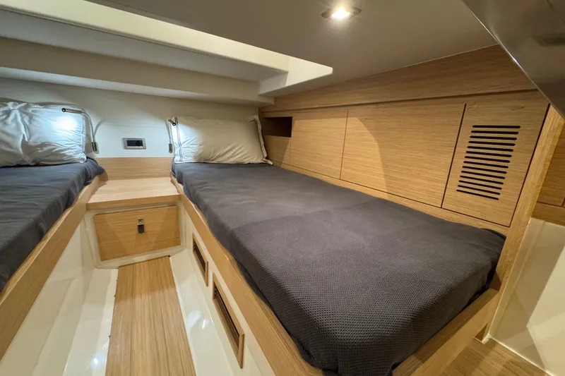 Slide: The Image of Luxurious cabin interior of 2025 Pardo Yachts P38 with twin beds and modern wood finish. - 27