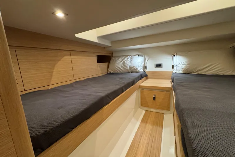Slide: The Image of Luxurious cabin interior of 2025 Pardo Yachts P38 with twin beds and modern wood finish. - 28