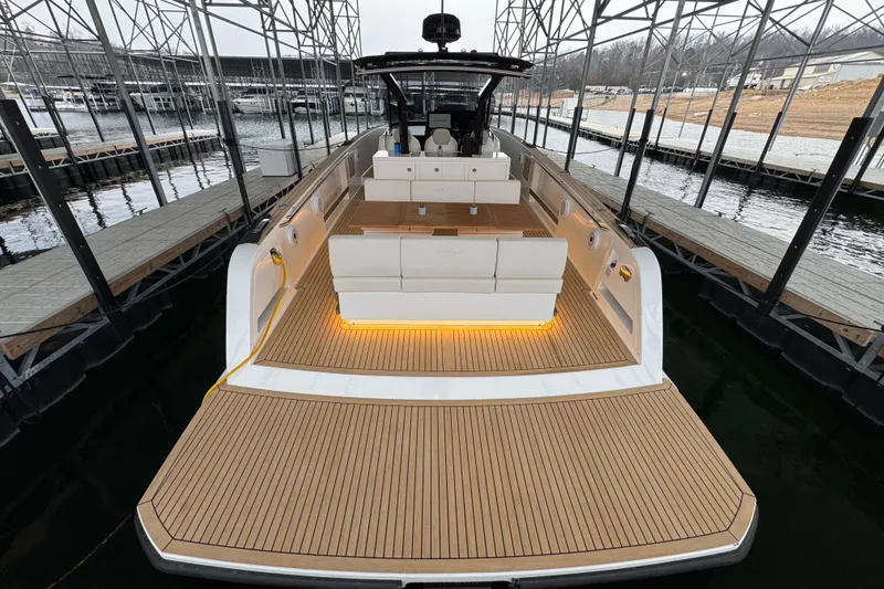 Slide: The Image of 2025 Pardo Yachts P38 luxury yacht with spacious deck and elegant seating in marina. - 5